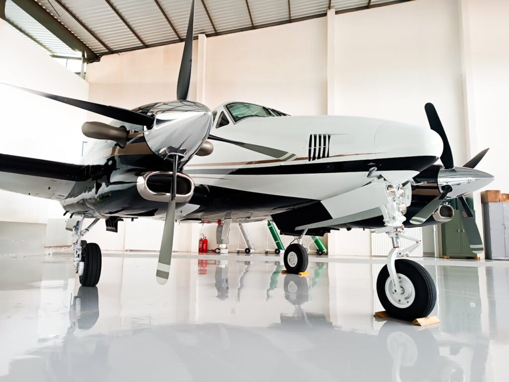 Small Aircraft Standing in a Bright Garage Hall